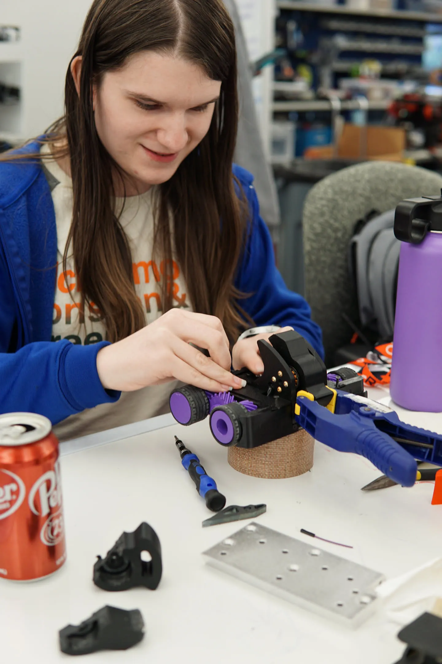 Natalie working on DotIO V2 wearing a blue jacket